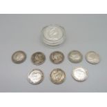 A silver £1 coin and eight silver threepences including 1901