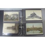 An album of Edwardian and later postcards, approximately 100