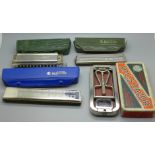 Three harmonicas comprising Hohner 2509, 2309 and Chromonica and a Rolls razor