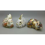 Three Royal Crown Derby paperweights, Meadow Rabbit with gold stopper, one other rabbit and a kitten
