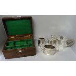 A three piece plated tea service and a plated caddy and a jewellery box with mother of pearl inlay