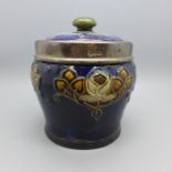 A silver rimmed Royal Doulton tobacco jar