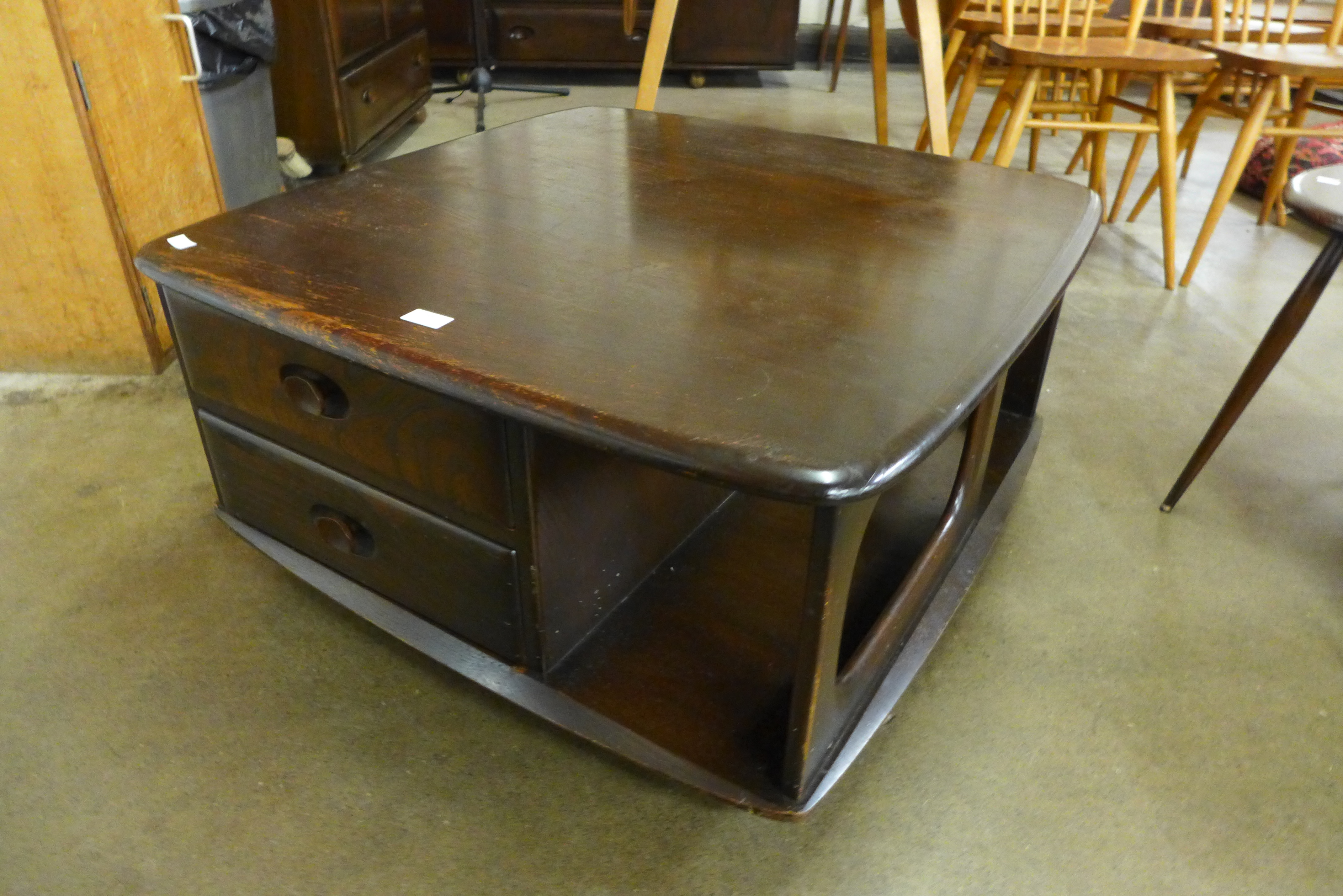 An Ercol dark elm Pandora's box coffee table