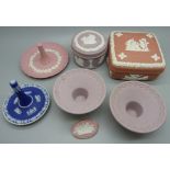 A collection of Wedgwood Jasperware; two lidded pots, two ring stands and a pair of candle holders