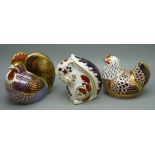 Three Royal Crown Derby paperweights, two hens and a squirrel, all with silver stoppers