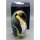 A Royal Crown Derby paperweight, Penguin and Chick, with stopper and red Royal Crown Derby stamp