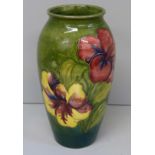 A Moorcroft Hibiscus vase with paper label to the base and painted marks, 19cm