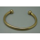 A 9ct gold torque bracelet, 10.5g, (dented)