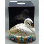 A Royal Crown Derby Paperweight - White Swan nesting, date mark for 1996, gold stopper and red Royal