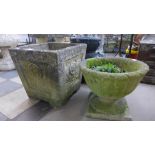 A concrete garden planter and a concrete urn