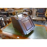 A Victorian walnut and brass mounted coal scuttle