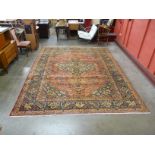 A fine early 20th Century hand knotted Persian red ground Senneh rug, 380 x 290cms