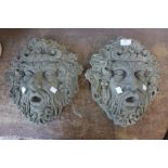 A pair of Bacchus concrete garden wall plaques