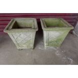 A pair of concrete planters