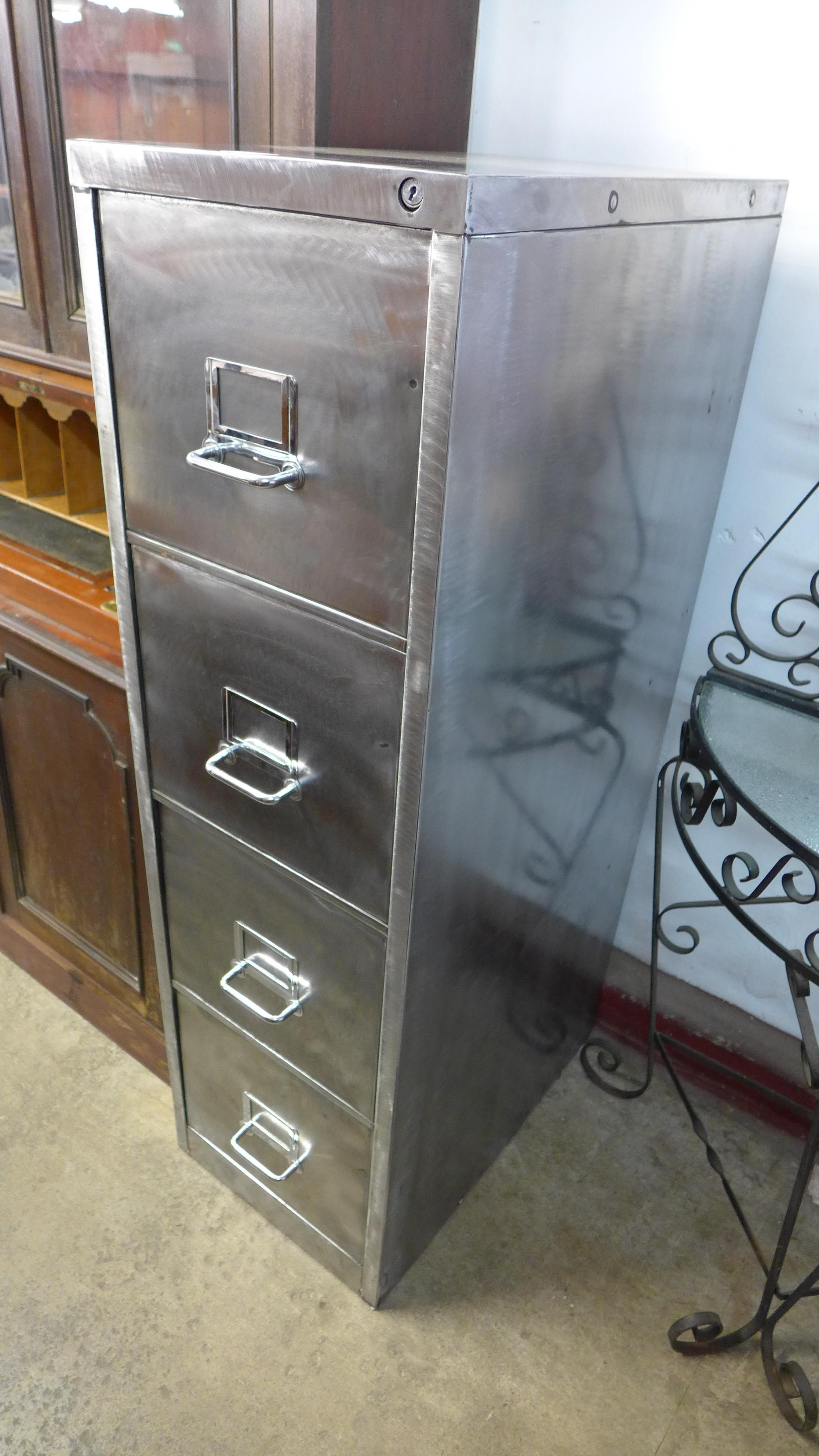 A polished steel industrial filing cabinet