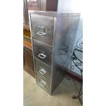 A polished steel industrial filing cabinet