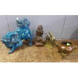 A ceramic dog of foe, a/f a brass model of a winged lion, a bronzed figure of a Chinese elder, a/f