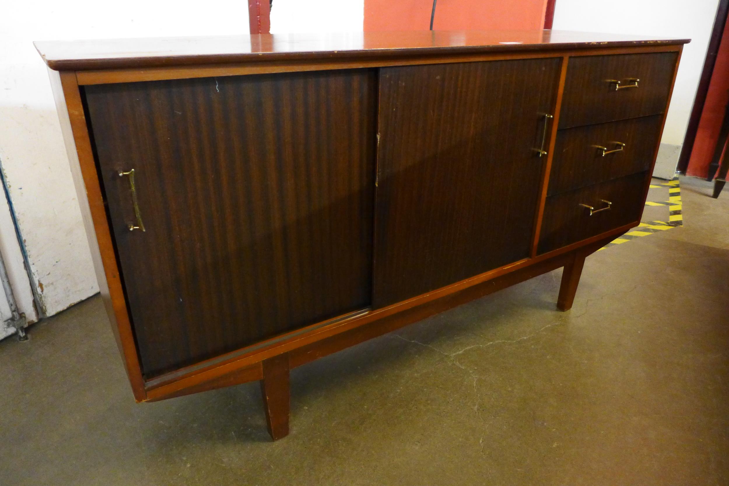 A teak and tola wood sideboard