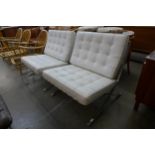 A pair of Barcelona style chrome and white leather lounge chairs