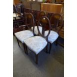 A set of four Edward VII inlaid mahogany chairs