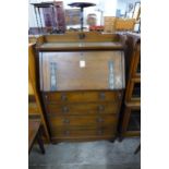 An Arts and Crafts oak bureau