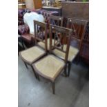A set of four French Empire style mahogany and gilt metal mounted chairs
