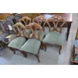 A set of five Victorian mahogany dining chairs