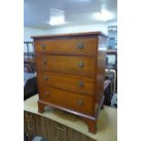 A small inlaid mahogany chest of drawers