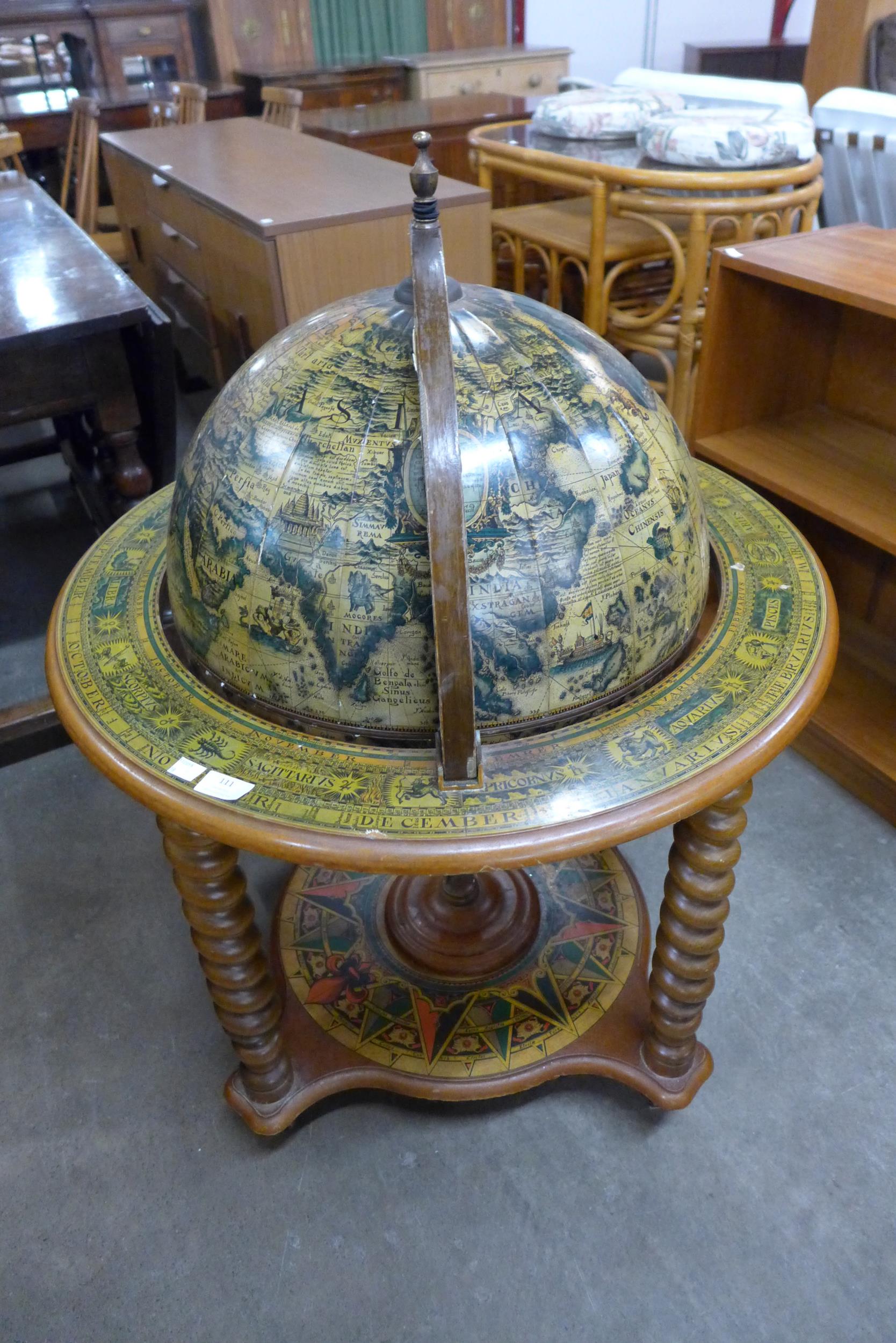 A terrestrial globe cocktail cabinet/trolley