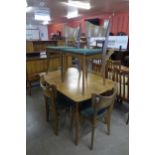 A Vanson afromosia dining table and six chairs