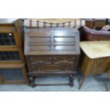 An oak geometric moulded bureau