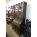 A Victorian mahogany cylinder secretaire bookcase