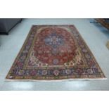 An eastern red ground rug,300 x 202cms