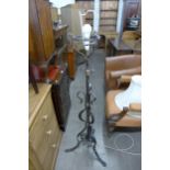 A Gothic style wrought iron floor standing lamp