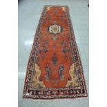 A Persian red ground Hamadan runner rug, 357 x 113cms