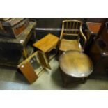An oak circular coffee table, an oak nest of tables, a gilt dressing table mirror and an elm chair