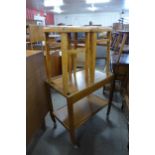 A teak single drawer trolley and a pair of beech stools