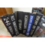 A set of six painted wooden street signs