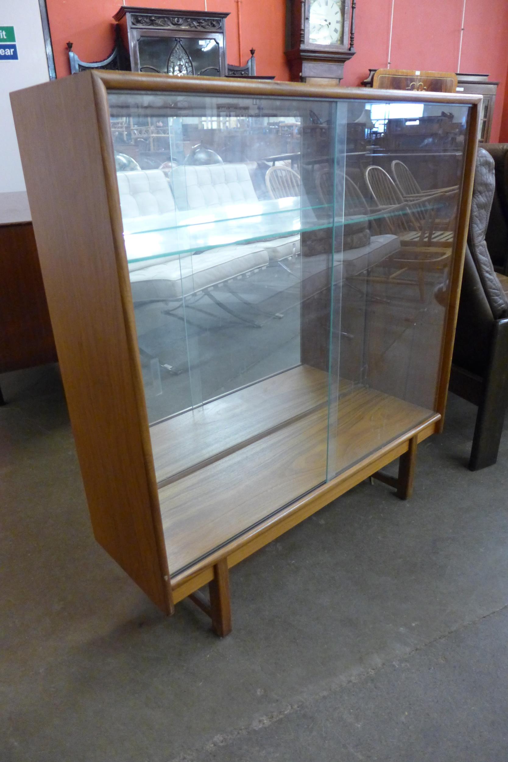 A Turnbridge teak display cabinet