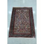 A Persian red ground Shiraz rug, 151 x 106cms