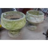 A pair of concrete planters