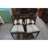 A set of four George III mahogany dining chairs