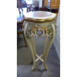 An Italian style cream, gilt and marble topped jardiniere stand