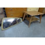 A teak coffee table and a simulated teak framed mirror