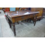 A Victorian mahogany two drawer writing table