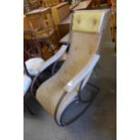A wrought steel rocking chair