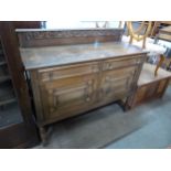 A carved oak sideboard