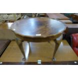 A walnut circular coffee table