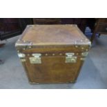 A brown leather and brass mounted trunk