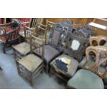 A set of four 18th Century elm rush seated chairs and a set of four 19th Century French carved oak